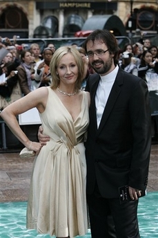 British author of the Harry Potter series of books, JK Rowling poses for the photographers as she arrives with her husband Neil Murray for the premiere of the latest Harry Potter film, 'Harry Potter and the Order of the Phoenix', at a cinema in central London, Tuesday July 3, 2007.