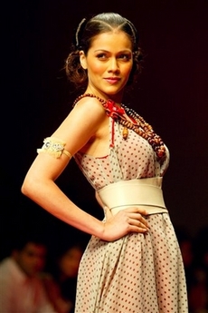 A model presents a creation by designer Surily Goel at the Lakme Fashion Week in Mumbai, India, Wednesday, Nov. 1, 2006.
