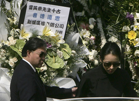 Timothy Fok (L), son of Hong Kong tycoon Henry Fok, and his ex-wife Loletta Chu leave after late billionaire tycoon Henry Fok Ying-tung's funeral outside a funeral home in Hong Kong November 7, 2006. 