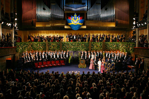 The Swedish Royal family and the 2006 Nobel Laureates listen to the national anthem of Sweden at the Nobel Prize ceremony at the Concert Hall in Stockholm December 10, 2006. The Nobel Prize is the first international award given yearly since 1901 for achievements in physics, chemistry, physiology or medicine, literature and peace. In 1968, the Sveriges Riksbank (Bank of Sweden) instituted the Prize in Economic Sciences in memory of Alfred Nobel, founder of the Nobel Prize. Each prize consists of a medal, personal diploma, and prize amount.