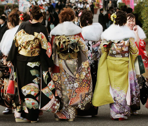Women in kimonos attend a ceremony celebrating their Coming of Age Day at Toshimaen amusement park in Tokyo January 8, 2007.