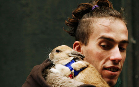 A bunny owner waits in line to have his pet blessed at Madrid's San Anton church January 17, 2007. Hundreds of pet owners bring their animals to be blessed every year on the day of San Anton, Spain's patron saint of animals.