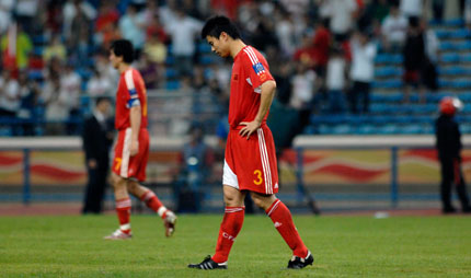 Chinese player Sun Xiang walks off the pitch after their 0-3 defeat to Uzbekistan during their 2007 AFC Asian Cup Group C soccer match in Shah Alam outside Kuala Lumpur July 18, 2007.