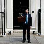 Britain makes huge cuts to avert debt crisis
