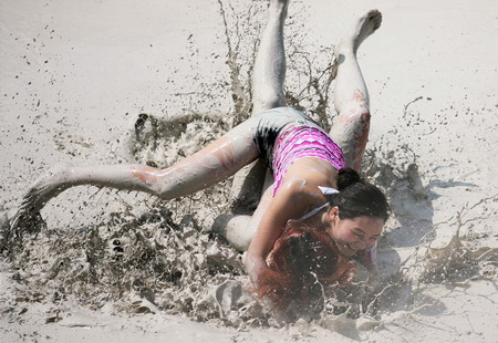 Mud and guts in women's mud wrestling contest
