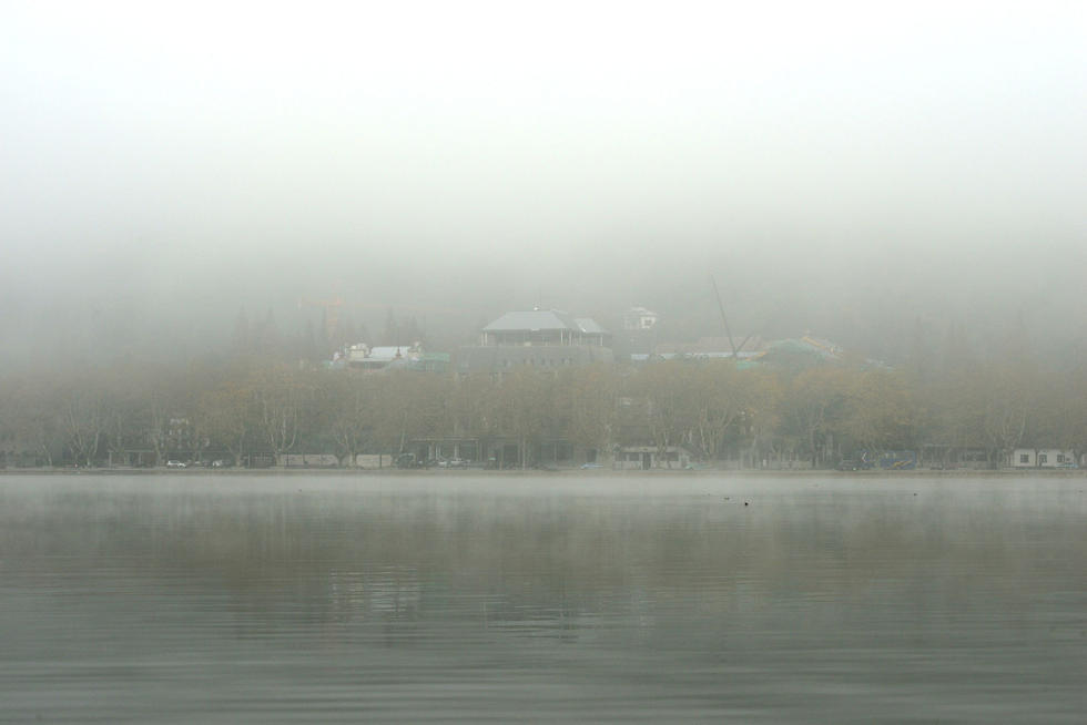 当雪后的杭州西湖遇上雾霾