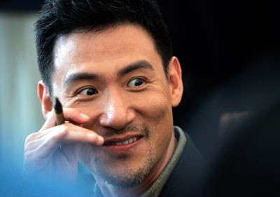 Hong Kong Singer Jacky Cheung reacts during a news conference of his world tour concert in Hong Kong August 15, 2007.
