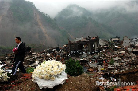 100 days after killer quake, people remember and rebuild
