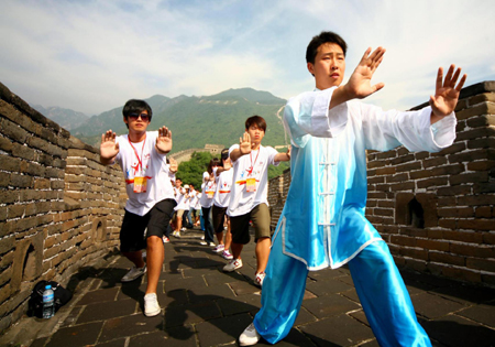Students practice Tai Chi on the Great Wall